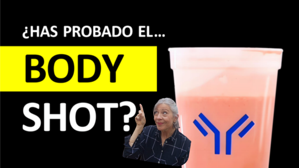 Heidi señalando el texto “¿Has probado el Body Shot?” de Immunotec.